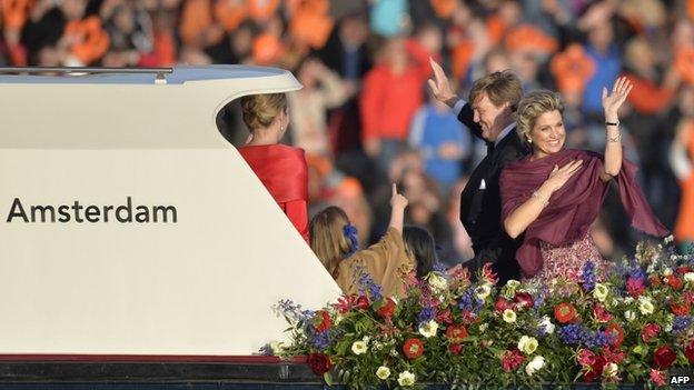 King Willem-Alexander and his wife Queen Maxima take part in a water pageant on the river IJ