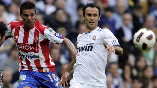 Nacho Novo (left) in action for Sporting Gijon against Real Madrid