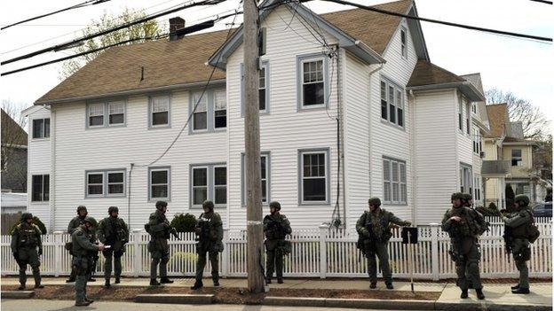 Police officers searching for Dzhokhar Tsarnaev