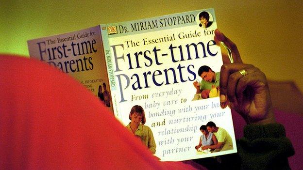 Man reading childcare book