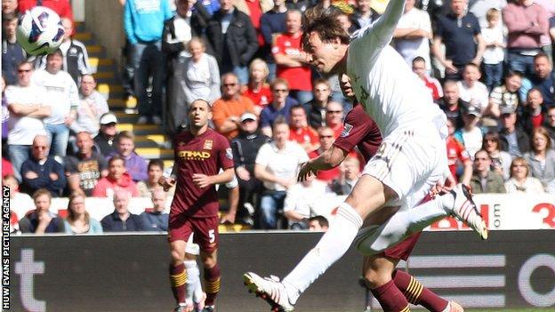 Michu on the attack for Swansea against Manchester City