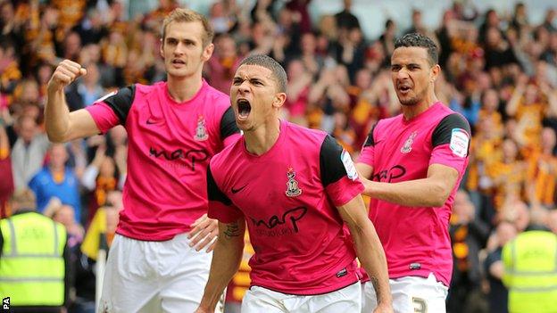 Bradford City's Nahki Wells (centre) celebrates scoring his side's decisive third goal at Burton