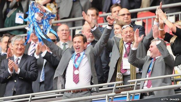 Manager Justin Edinburgh celebrates after the match