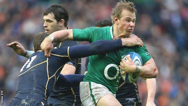 Luke Marshall playing against Scotland in the Six Nations