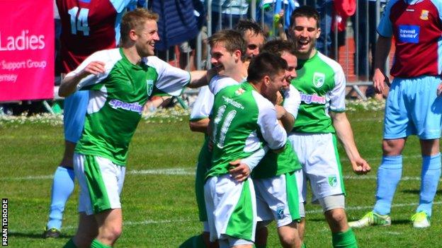 Guernsey FC players celebrate their goal against Farnham Town