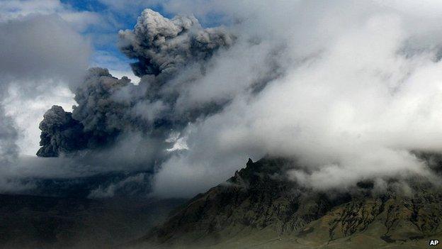 A plume of ash rises from a volcano erupting under the Eyjafjallajokull glacier