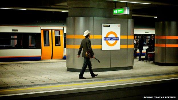 Ukelele man at Dalston Junction station