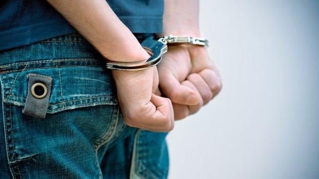 Teenager in handcuffs