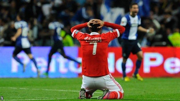 Benfica's Oscar Cardozo shows his disappointment