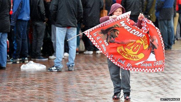 Child holds flag at Old Trafford