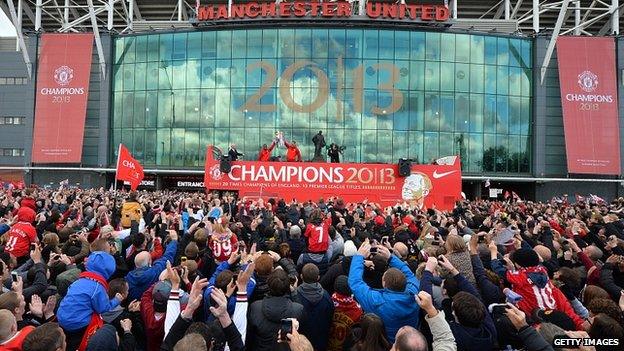 Fans photograph the bus at Old Trafford