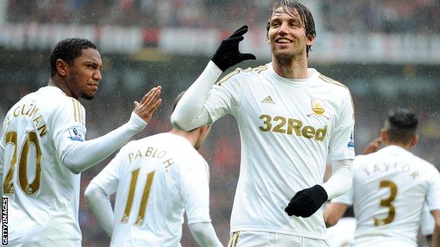 Michu celebrates scoring at Old Trafford