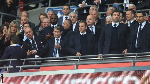 Man City manager Roberto Mancini (left) after shaking hands with the club's board after the FA Cup defeat by Wigan