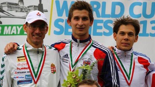 Jamie Cooke (centre) receives his World Cup gold medal