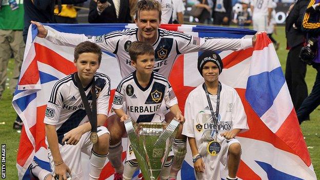 David Beckham poses with his sons Brooklyn Beckham, Cruz Beckham and Romeo Beckham