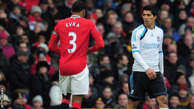 Luis Suarez and Patrice Evra