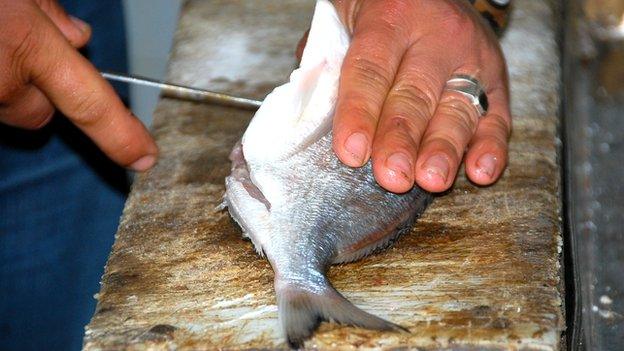 Chef Asad Abu Haseera prepares a sea bream