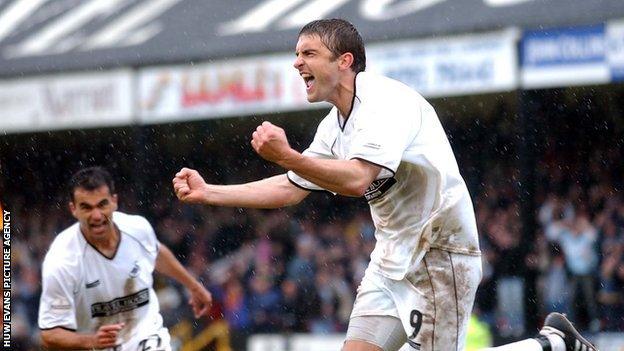 James Thomas celebrates after his hat-trick against Hull keeps Swansea in the Football League