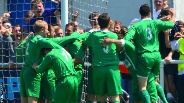 Guernsey celebrate Craig Young's opening goal