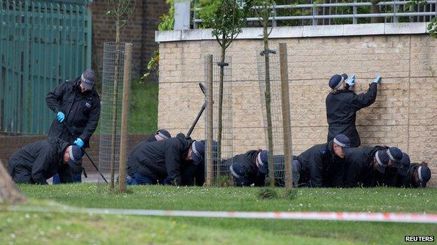 Police carry out a fingertip search