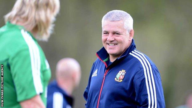 Warren Gatland shares a joke with Richard Hibbard during a Lions training session