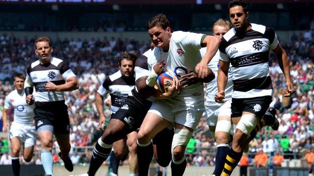 Freddie Burns is tackled for England against the Barbarians at Twickenham