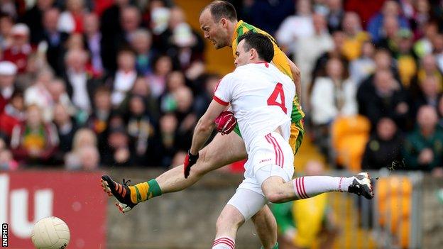 Colm McFadden holds off Cathal McCarron to score Donegal's first-half goal