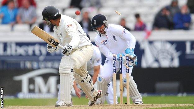 Graeme Swann (out of picture) bowls New Zealand batsman Ross Taylor