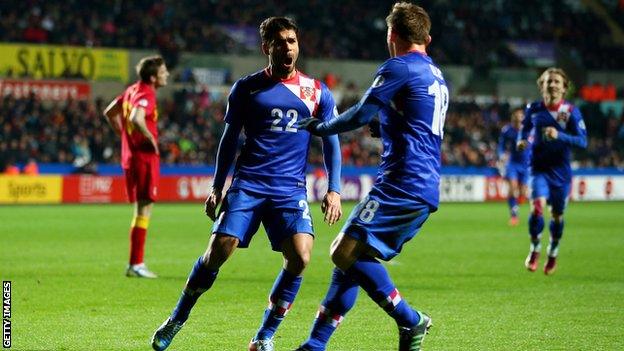 Croatia players celebrate scoring against Wales in a World Cup qualifier