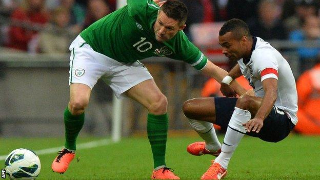 Robbie Keane of the Republic of Ireland in action against England captain Ashley Cole