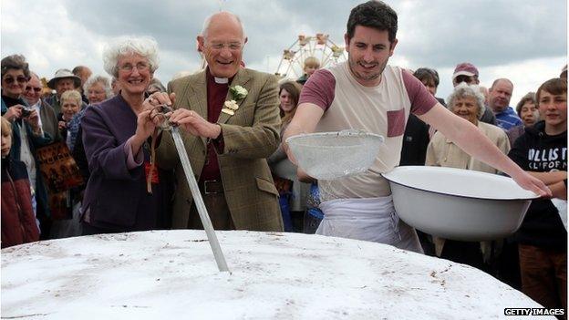 Huge Victoria sponge cut by the Bishop of Bath and Wells, the Right Reverend Peter Price, Royal Bath and West Show May 2013