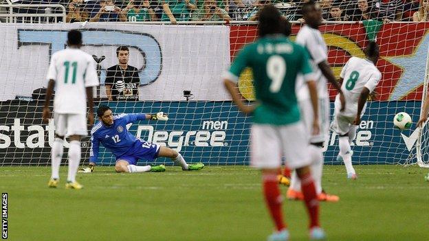 Nigeria's Brown Ideye scoring from the penalty spot against Mexico