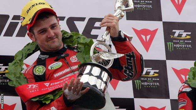 Michael Dunlop celebrates victory at the Isle of Man TT