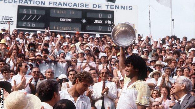 Yannick Noah lifts the French Open trophy