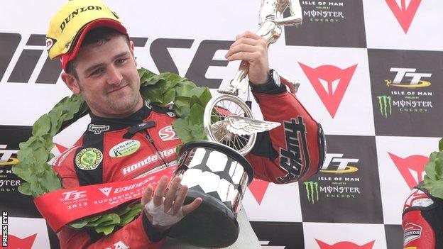 Michael Dunlop celebrates victory at the Isle of Man TT