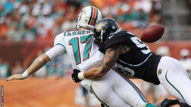 Jacksonville defence forces Miami Dolphins quarterback Ryan Tannehill to fumble