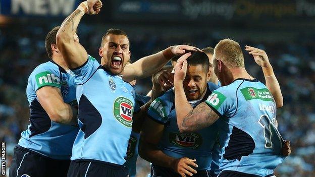 New South Wales celebrate scoring against Queensland