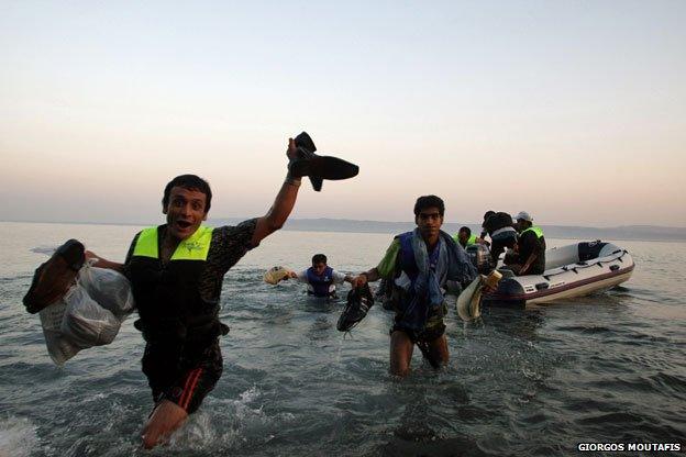 Syrian refugees clamber ashore, Lesbos