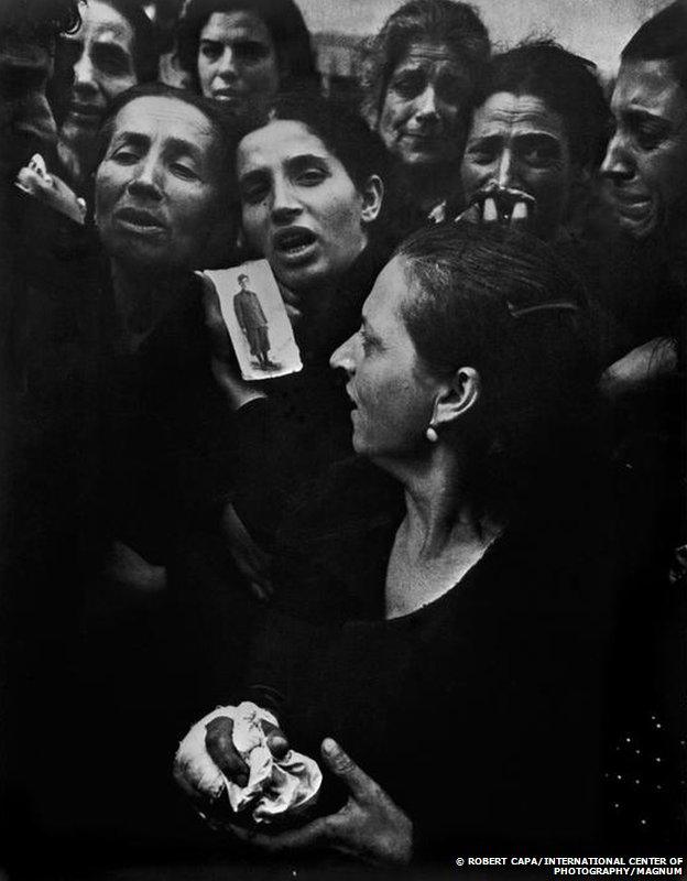 People mourn at the funeral of 20 teenagers in Naples, 1943