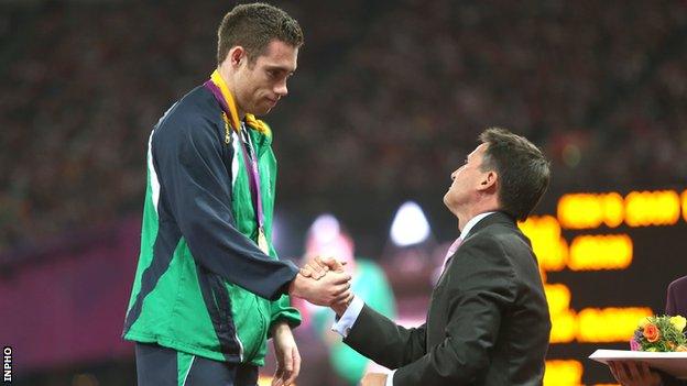 Jason Smyth receives his London Paralympics 200m gold medal from Lord Sebastian Coe last September