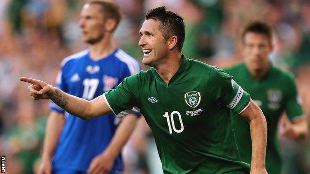 Robbie Keane celebrates his third goal