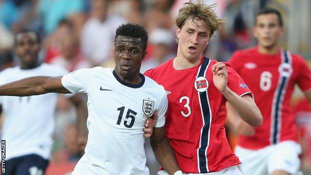 England Under-21s' Wilfred Zaha is challenged by Thomas Rogne