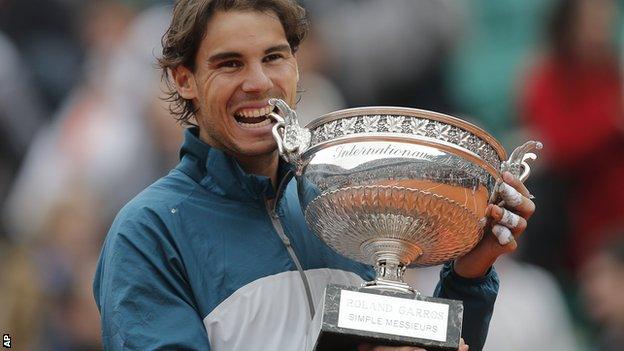 Rafael Nadal poses with the trophy