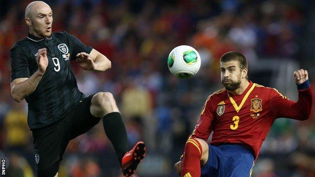 Conor Sammon and Gerard Pique