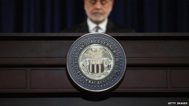 US Federal Reserve chairman Ben Bernanke behind a lectern