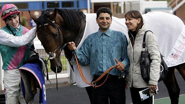 Jockey James Doyle (left), with stable hand and Lady Cecil