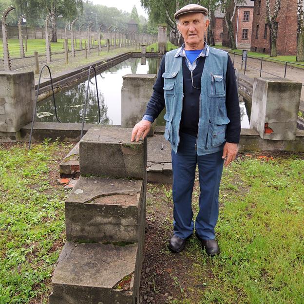 Yechiel Aleksander with the concrete steps he built