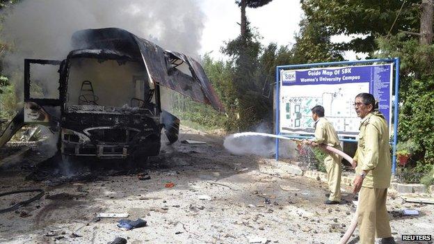 Wreckage of a bus destroyed in a university bomb blast in Quetta, Pakistan, 15 June