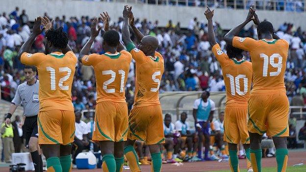 Ivory Coast players celebrate their progress to the third and final round of African qualifying.