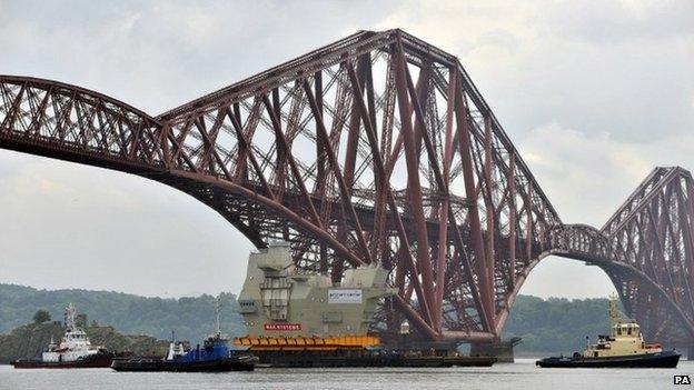 Piece of HMS Queen Elizabeth passes under Forth Bridge